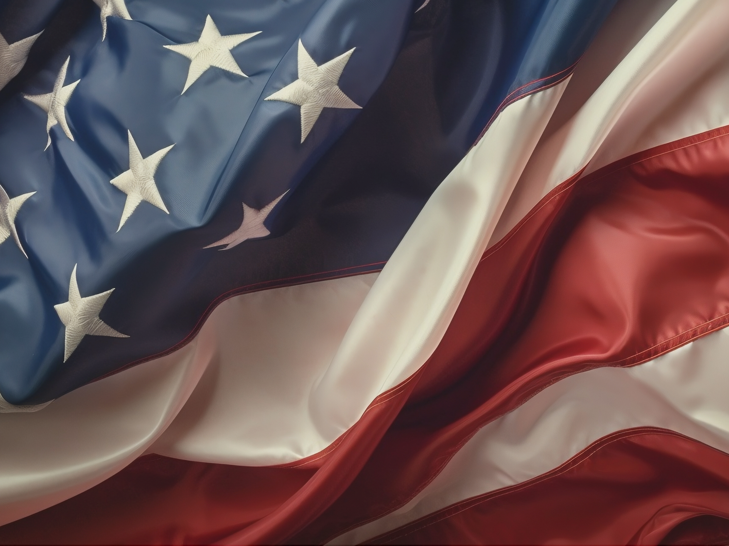 Close-up of an American flag with stars and stripes.