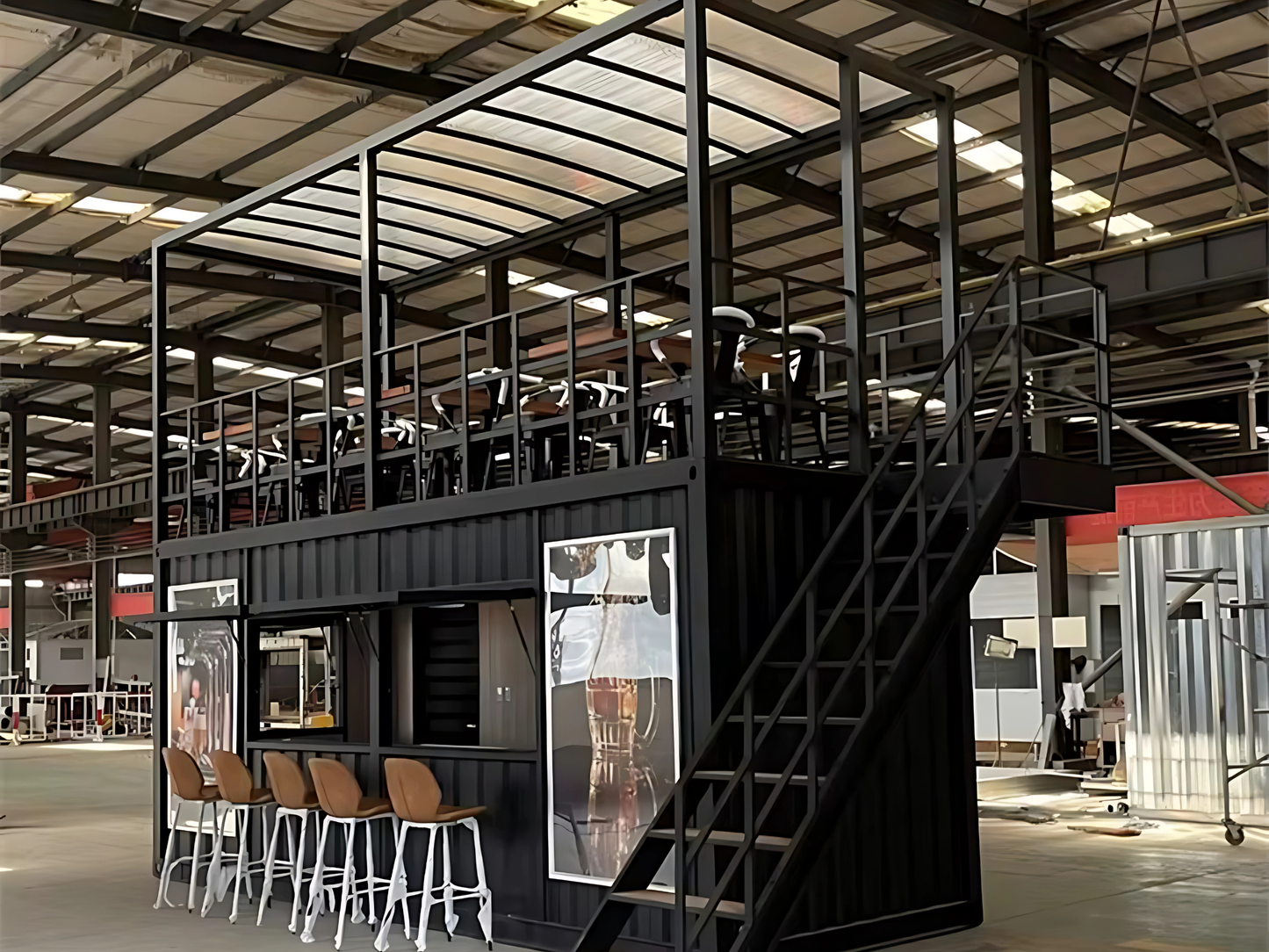 Modern industrial interior with container shop and loft area.