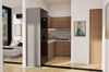Modern kitchen with wooden cabinets and a view into a bedroom.