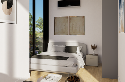 Modern bedroom with a bed, nightstands, and large windows.