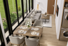 Modern living room with a dining table set for four, large windows, and laundry appliances.