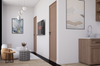 Modern interior with a kitchen and living area, featuring a TV mounted on the wall.