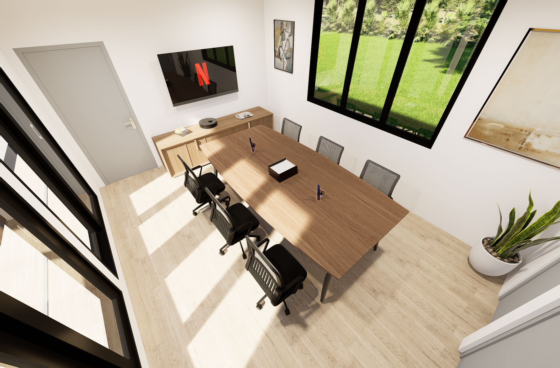 Modern office with a wooden desk, chairs, and a TV displaying a streaming service.