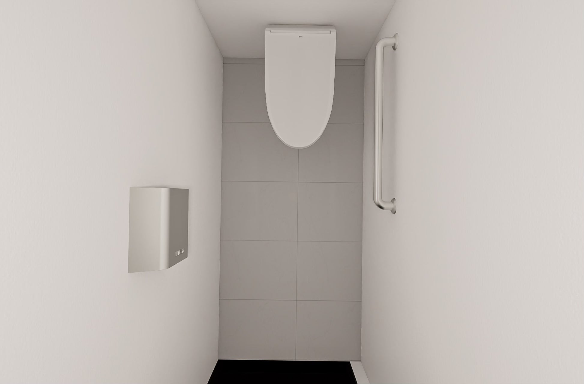 Modern bathroom with a toilet and tiled walls.