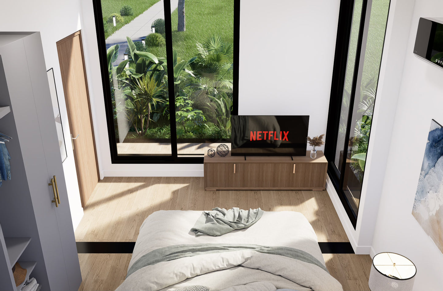 Modern bedroom with a bed, TV displaying 'Netflix', and large windows.