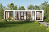 Modern container house with glass windows in a green, tree-lined area