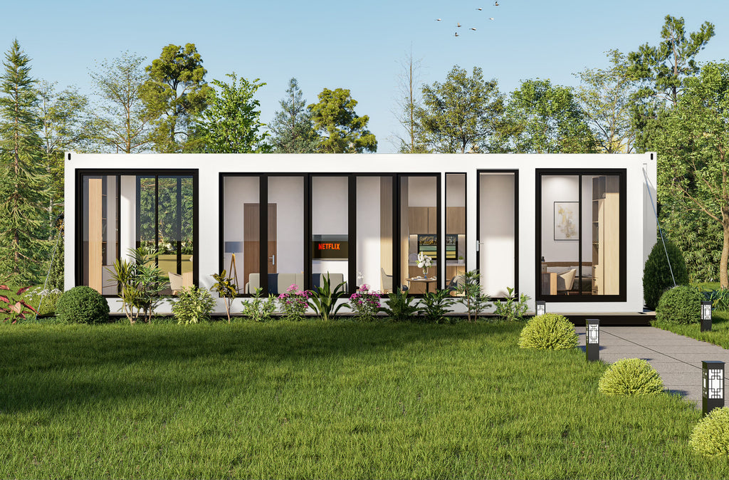 Modern container house with glass windows in a green, tree-lined area