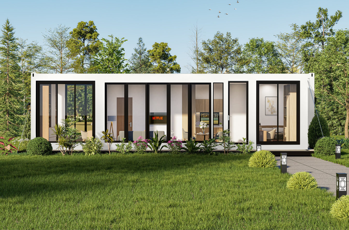 Modern container house with glass windows in a green, tree-lined area