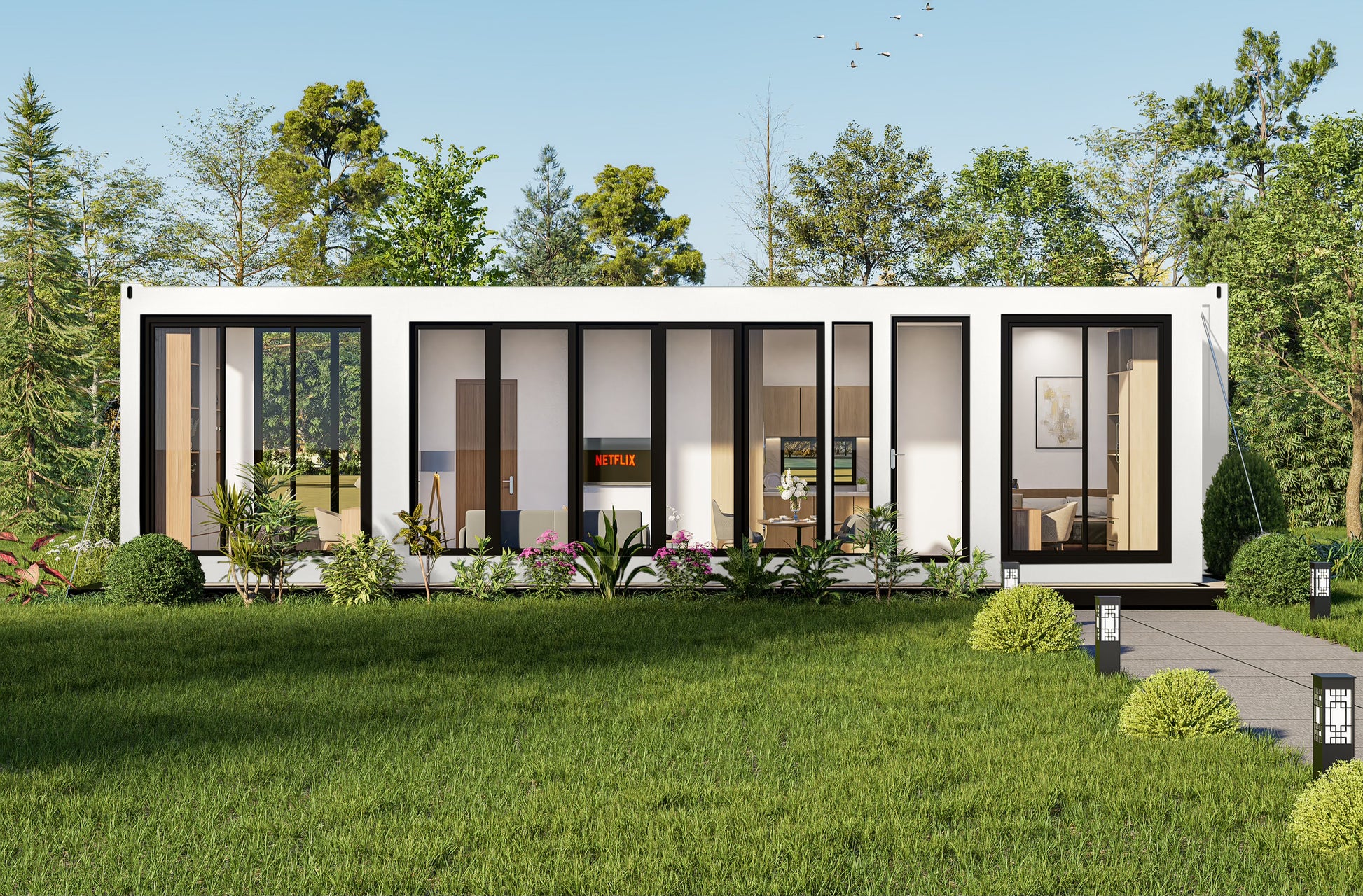 Modern container house with glass windows in a green, tree-lined area