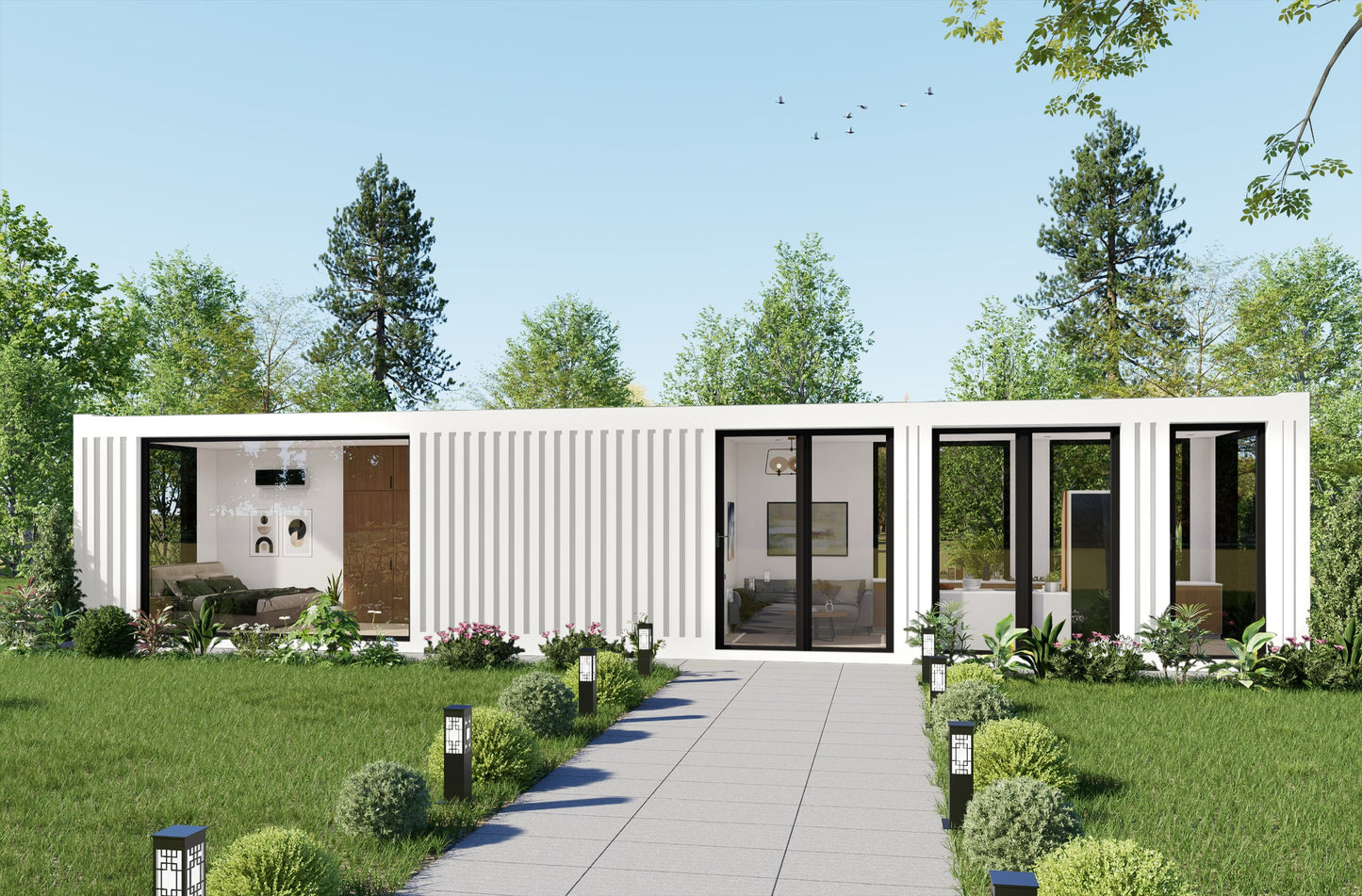 Modern container house with glass doors and white exterior, surrounded by greenery.