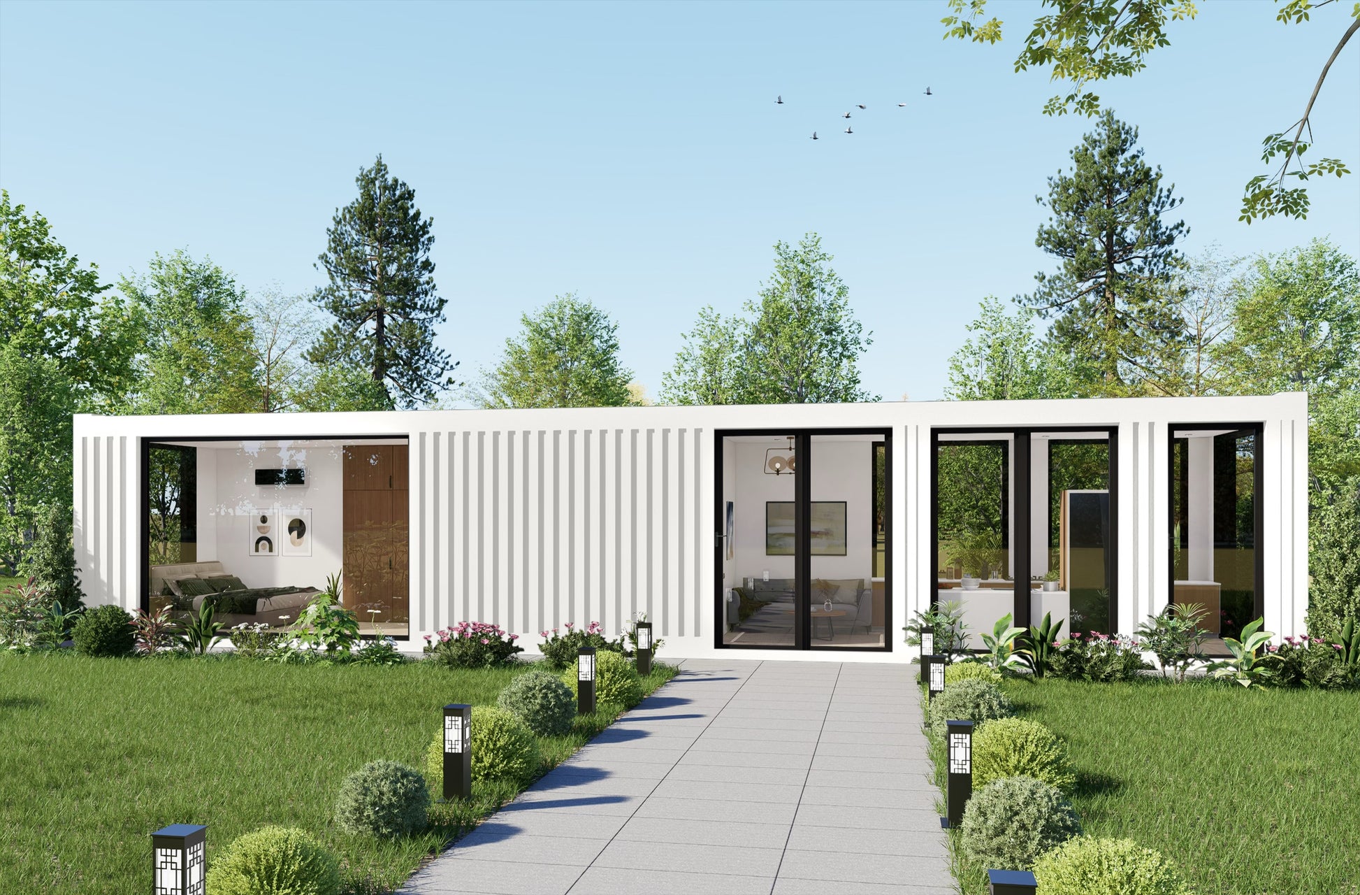 Modern container house with glass doors and white exterior, surrounded by greenery.