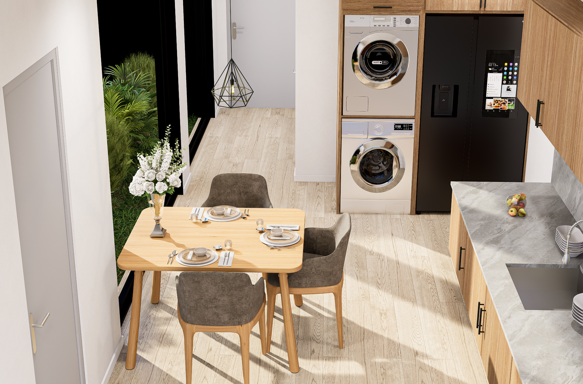 Modern kitchen with dining area, washer, dryer, and refrigerator.