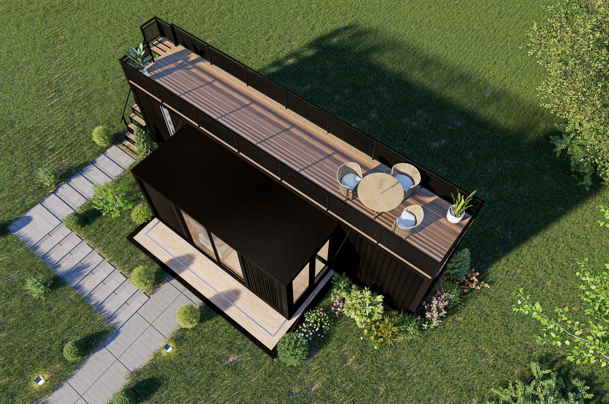 Container home with a deck and outdoor furniture on a grassy area