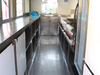 Modern kitchen with stainless steel counters and appliances