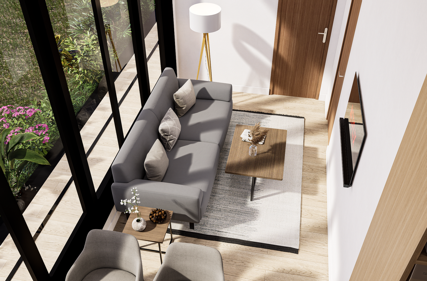 Modern living room with gray sofa, coffee table, and decorative items.