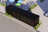 Black shipping container on a street with greenery and buildings in the background
