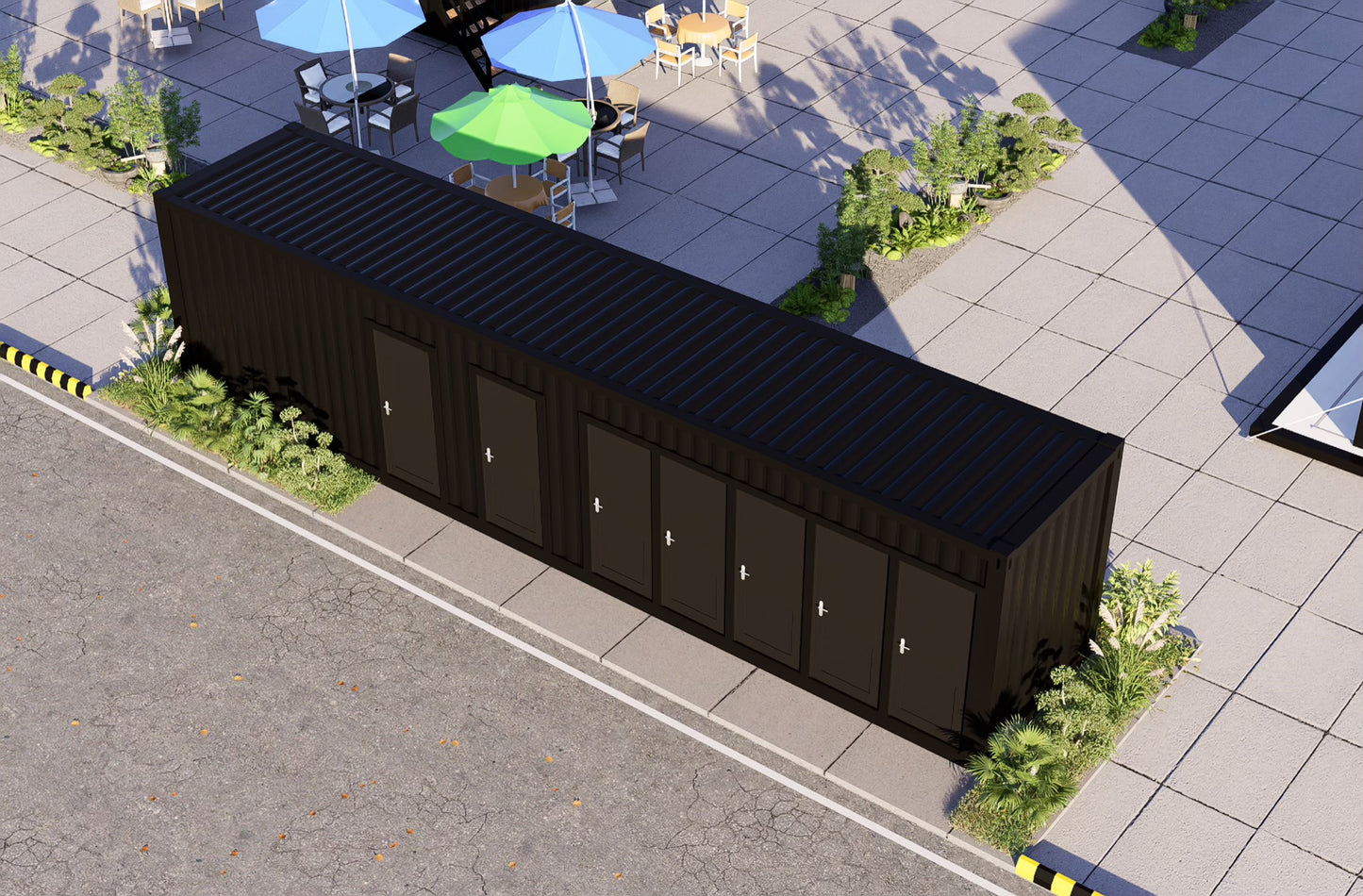 Black shipping container on a street with greenery and buildings in the background