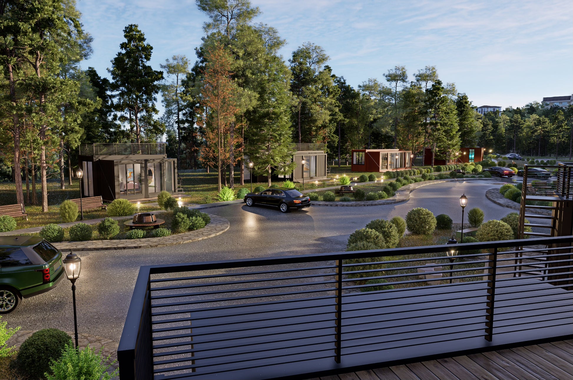 Gated community with cars, pathways, and greenery. All homes are made with shipping containers. 
