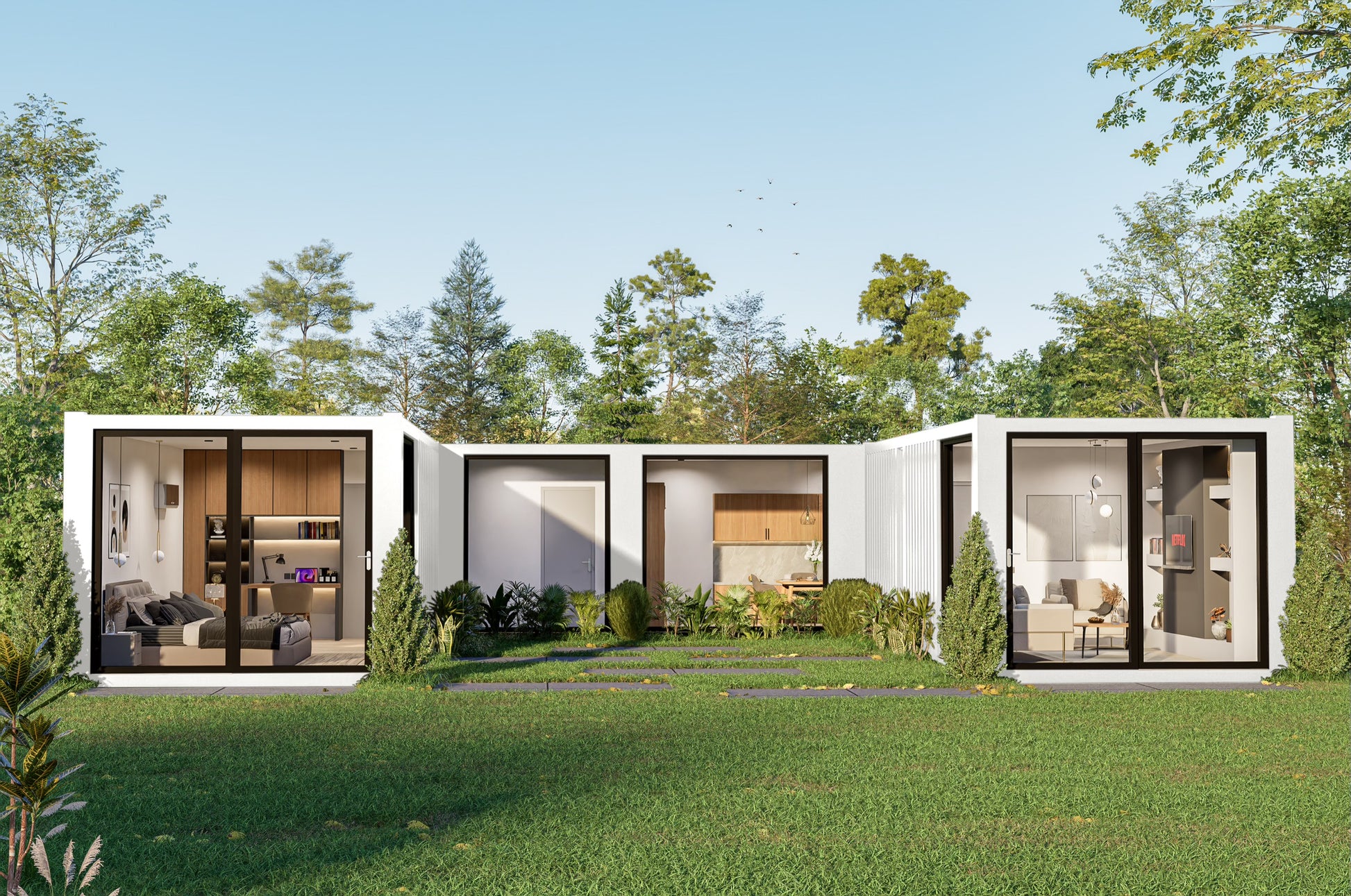 A multi-unit container modular building with glass doors and windows in a green outdoor setting