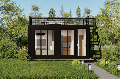 Modular building with a rooftop deck in a green, natural setting
