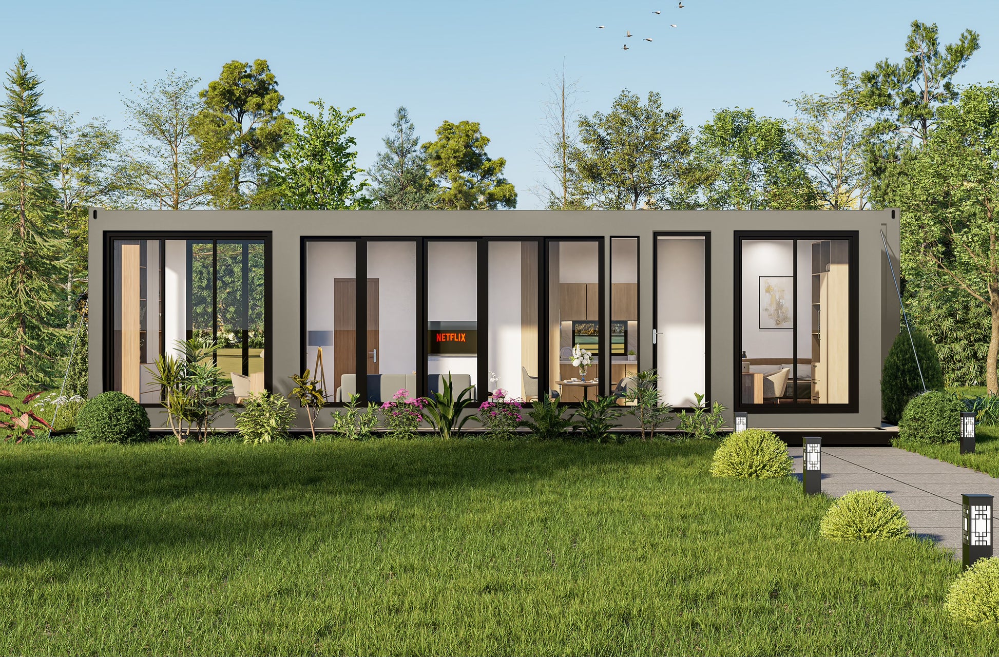 Modern container modular building with glass windows in a green outdoor setting