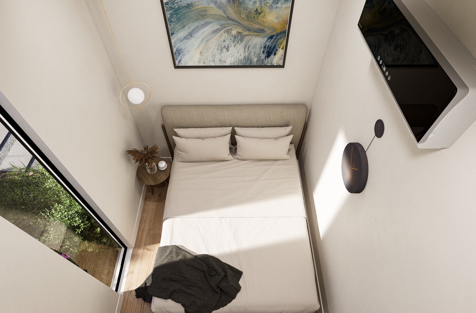 Small bedroom with a bed, side table, and wall art.