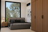 Modern bedroom with bed, wardrobe, and large window